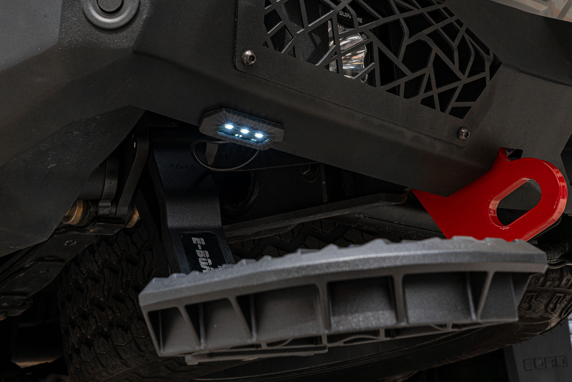 Supreme Electric Rear Step deployed with activated integrated LED lights for night-time visibility and safety