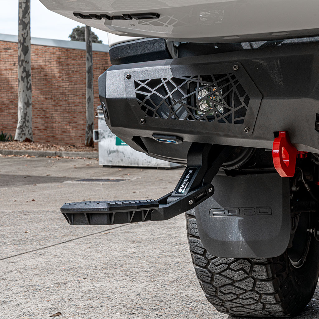 supreme electric rear steps deployed when the tail gate is open suited for the supreme x-series rear bar